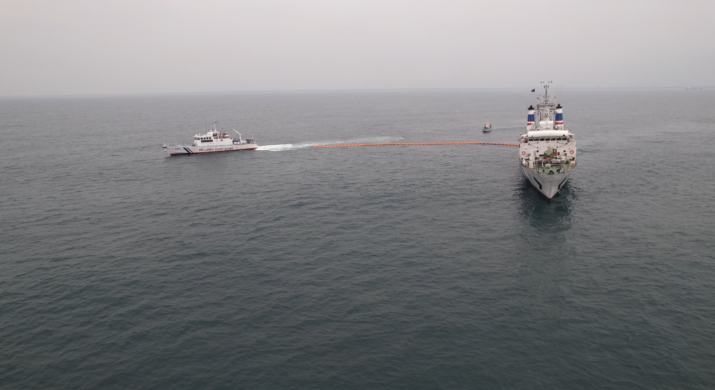 Training of Oil Recovery Using an Oil Boom and Patrol Vessels